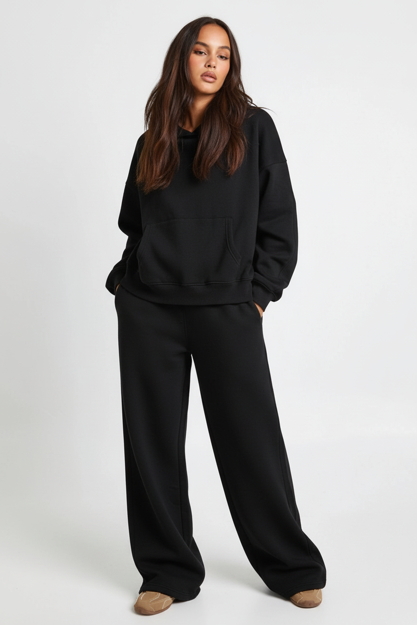 Black coord set with hands in pockets